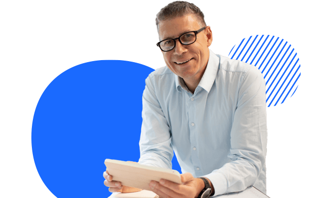 A person smiling with a tablet