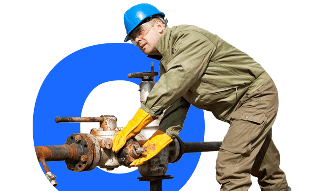 A person opening a large valve