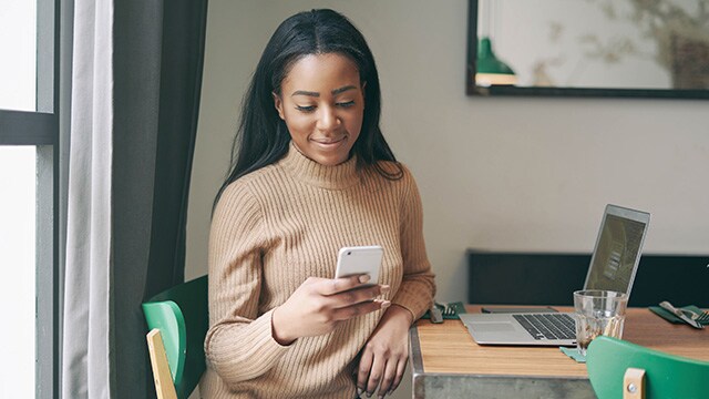 A person looking at their mobile phone