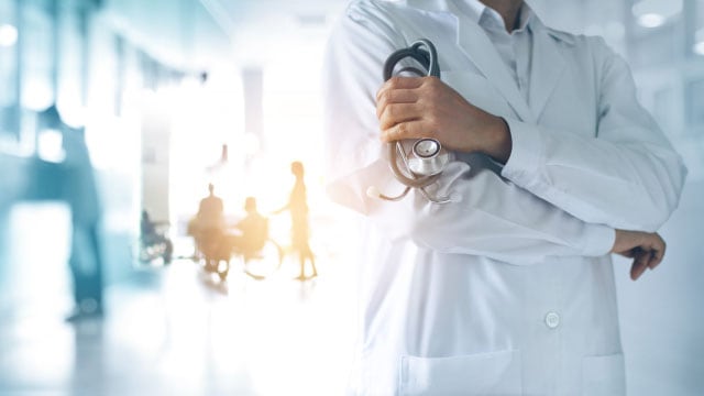 A person holding a stethoscope