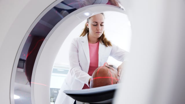 A person about to receive a mri scan of her head