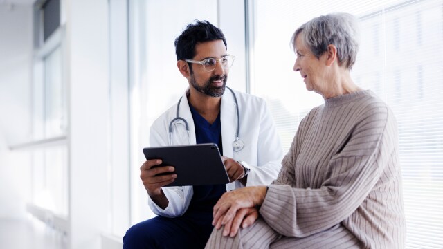 A doctor discussing reports with patient