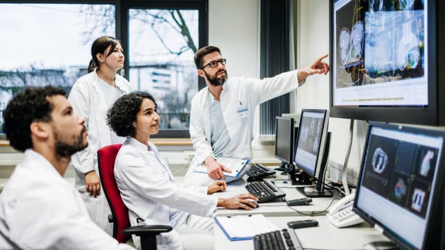 Doctors discussing scan results of xray images