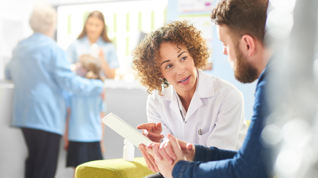 Doctor explaining form to patient